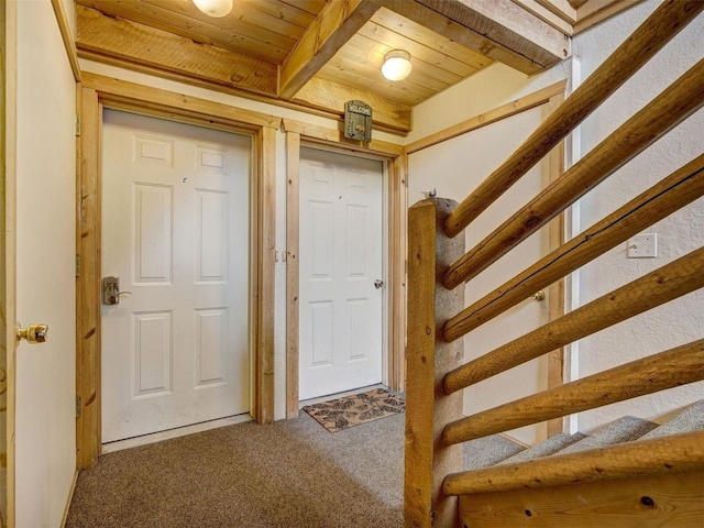 100 Cove Blvd Unit F, Dillon, CO 80435 - hall featuring wooden ceiling with exposed beams, carpet floors, and stairs