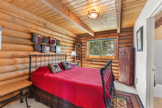 100 Cove Blvd Unit F, Dillon, CO 80435 - bedroom with wood ceiling with exposed beams, rustic walls, and carpet floors