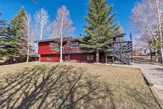 314 17th St, Kremmling, CO 80459 - rear view of property with a yard, stairway, and a deck