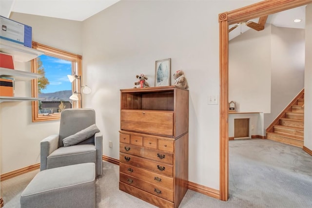 sitting room featuring light colored carpet