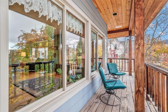 sunroom with wood ceiling