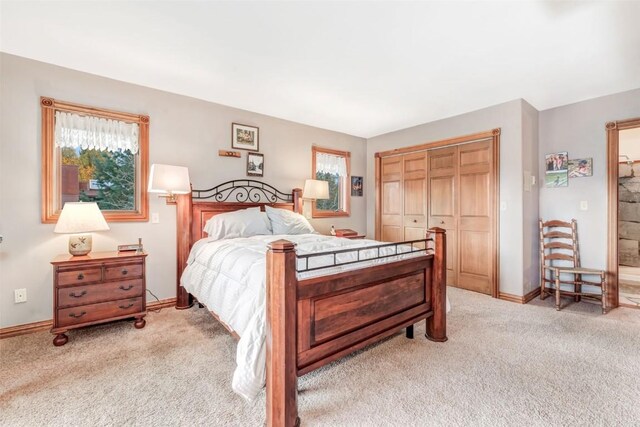 carpeted bedroom featuring a closet