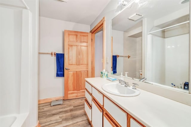 bathroom with vanity and hardwood / wood-style flooring