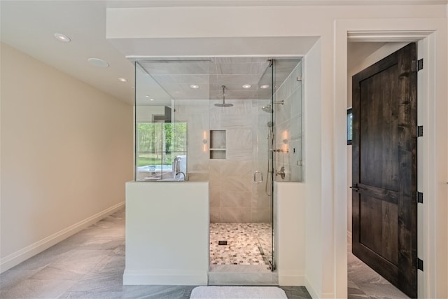 full bathroom with recessed lighting, baseboards, and a stall shower
