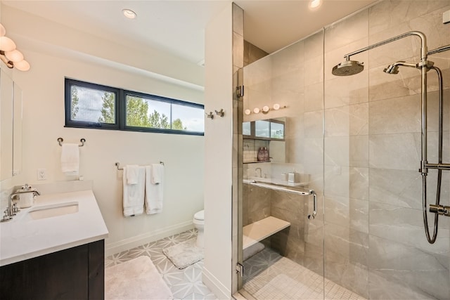 full bath featuring vanity, tile patterned flooring, toilet, recessed lighting, and a shower stall