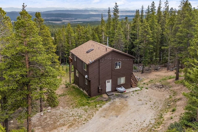 1576 Bobcat Ln, Fairplay, CO 80440 - aerial view of property and surrounding area with a mountain backdrop and a heavily wooded area