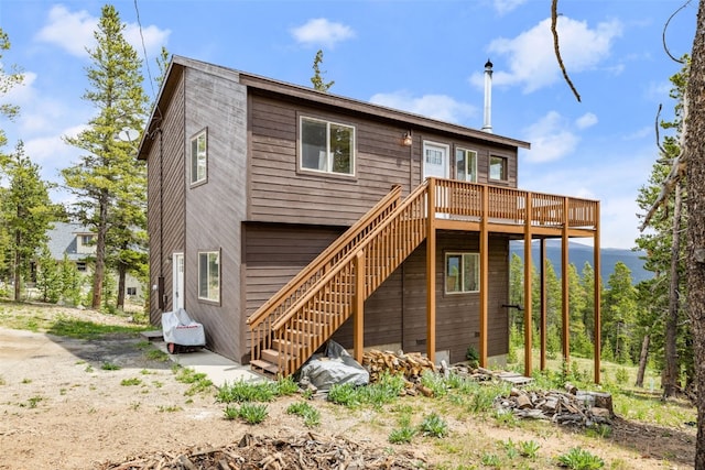 1576 Bobcat Ln, Fairplay, CO 80440 - back of property with a wooden deck and stairway