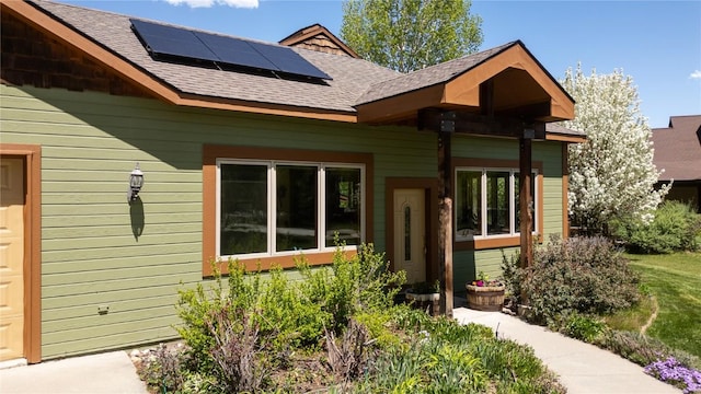 40870 Purple Sage St, Steamboat Springs, CO 80487 - property entrance with solar panels and roof with shingles