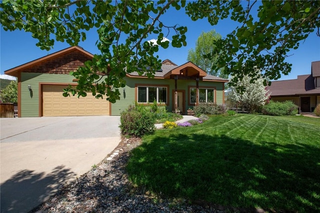 40870 Purple Sage St, Steamboat Springs, CO 80487 - ranch-style house featuring driveway, a garage, and a front lawn