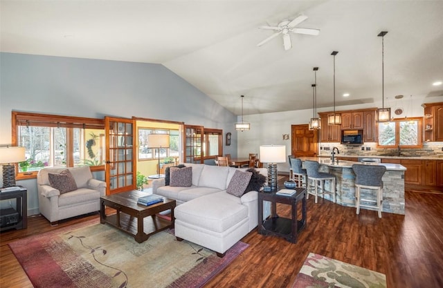 40870 Purple Sage St, Steamboat Springs, CO 80487 - living area featuring dark wood-type flooring, ceiling fan, and high vaulted ceiling