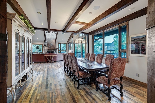 19 Peak 8 Ct, Breckenridge, CO 80424 - dining space with beam ceiling, hardwood / wood-style flooring, and a fireplace