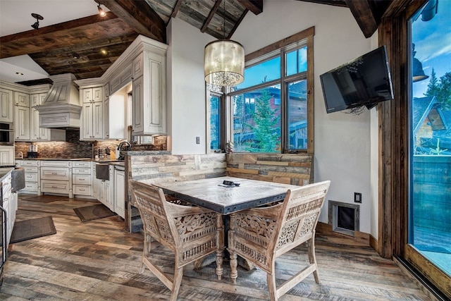 19 Peak 8 Ct, Breckenridge, CO 80424 - kitchen with custom exhaust hood, dark wood-style floors, decorative backsplash, and dark countertops