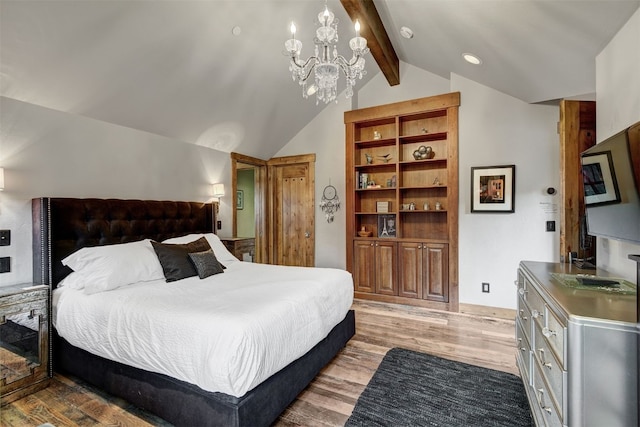 19 Peak 8 Ct, Breckenridge, CO 80424 - bedroom with light wood-type flooring and a chandelier