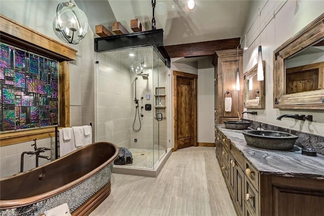 19 Peak 8 Ct, Breckenridge, CO 80424 - full bath with a freestanding tub, a shower stall, double vanity, and wood finished floors