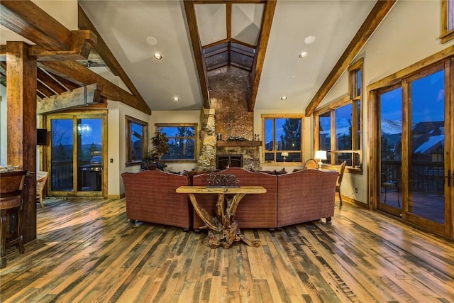 19 Peak 8 Ct, Breckenridge, CO 80424 - living room featuring beamed ceiling, wood finished floors, a fireplace, and high vaulted ceiling