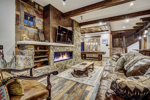 19 Peak 8 Ct, Breckenridge, CO 80424 - living area featuring hardwood / wood-style flooring, beamed ceiling, a large fireplace, and recessed lighting