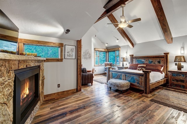 19 Peak 8 Ct, Breckenridge, CO 80424 - bedroom featuring wood finished floors, a lit fireplace, and ceiling fan