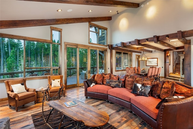 19 Peak 8 Ct, Breckenridge, CO 80424 - living area with beam ceiling, wood finished floors, recessed lighting, stairs, and high vaulted ceiling