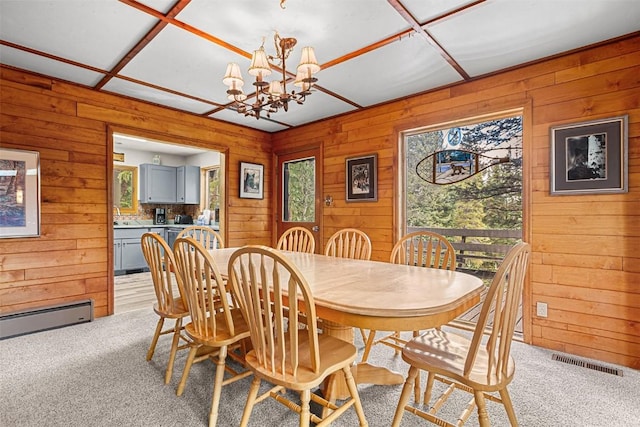 3312 Boreas Pass Rd, Breckenridge, CO 80424 - dining room featuring wood walls, plenty of natural light, light carpet, and baseboard heating