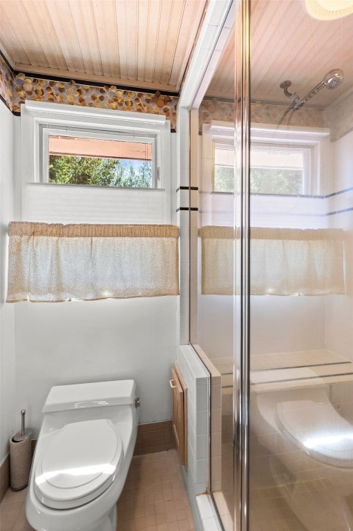 862 Douglas St, Steamboat Springs, CO 80487 - bathroom featuring wood ceiling, a shower stall, toilet, and tile patterned floors