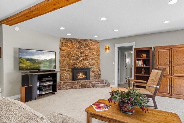 862 Douglas St, Steamboat Springs, CO 80487 - living area featuring light carpet, recessed lighting, a stone fireplace, and baseboards