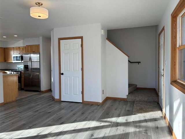 1550 Red Hawk Ct, Steamboat Springs, CO 80487 - interior space featuring stairway, baseboards, wood finished floors, and recessed lighting