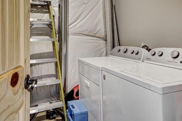 washroom featuring washing machine and dryer