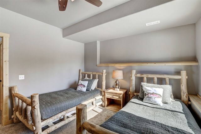 bedroom with ceiling fan and carpet flooring