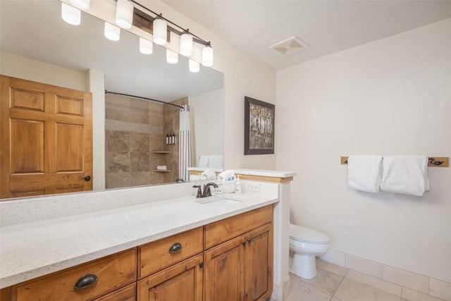 1463 Flattop Cir Unit 302, Steamboat Springs, CO 80487 - bathroom featuring vanity, tiled shower, and tile patterned flooring