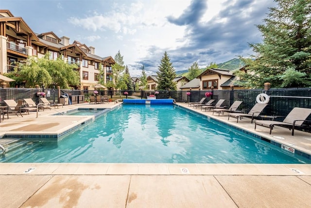 1463 Flattop Cir Unit 302, Steamboat Springs, CO 80487 - view of pool with a residential view, a patio, and a pool with connected hot tub