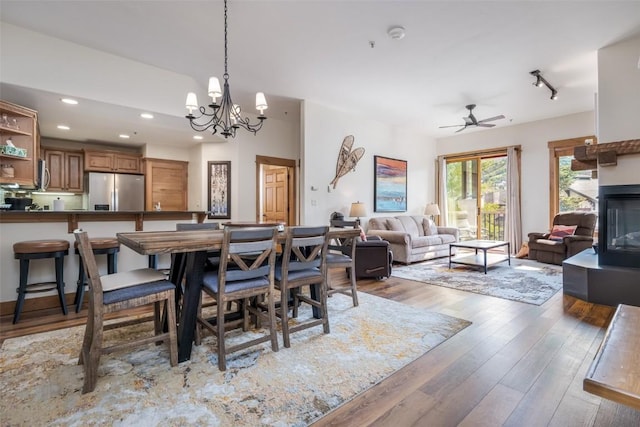 1463 Flattop Cir Unit 302, Steamboat Springs, CO 80487 - dining room with wood finished floors, a chandelier, a ceiling fan, and recessed lighting