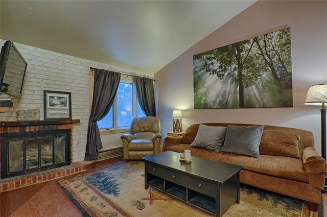 246 Broken Lance Dr Unit 203, Breckenridge, CO 80424 - living room with vaulted ceiling, wood finished floors, and a fireplace