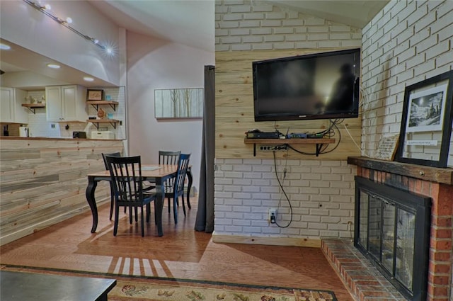 246 Broken Lance Dr Unit 203, Breckenridge, CO 80424 - dining area with lofted ceiling, a fireplace, and recessed lighting