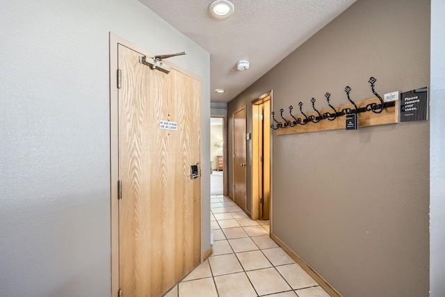 corridor featuring light tile patterned floors