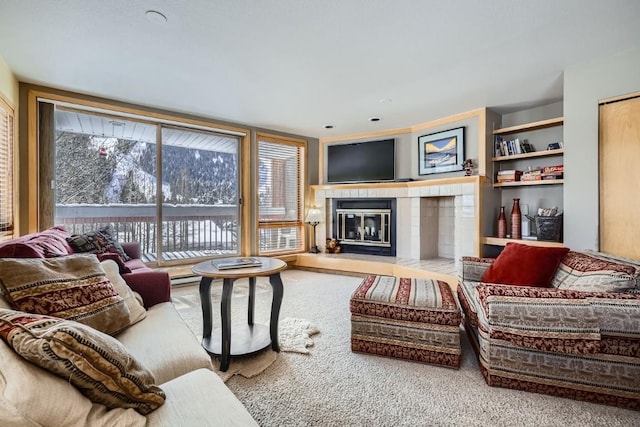 carpeted living area featuring a fireplace