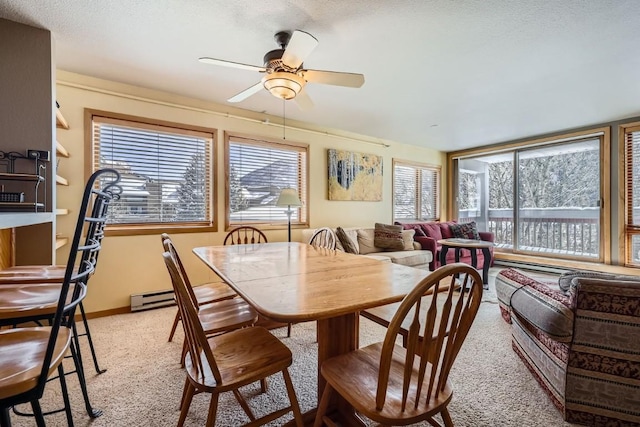 dining room with light carpet, a wealth of natural light, and ceiling fan