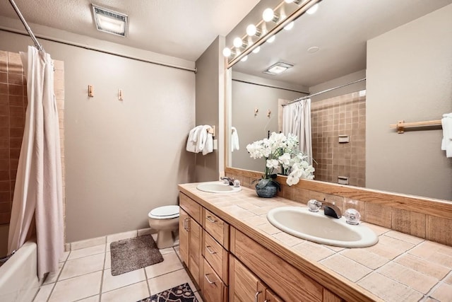 full bath with toilet, tile patterned floors, a sink, and visible vents