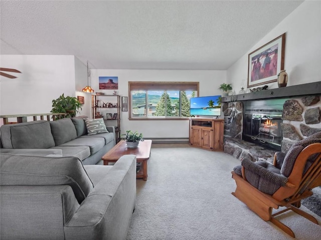 1346 Rainbow Dr, Silverthorne, CO 80498 - living area with a textured ceiling, a stone fireplace, light carpet, and baseboard heating