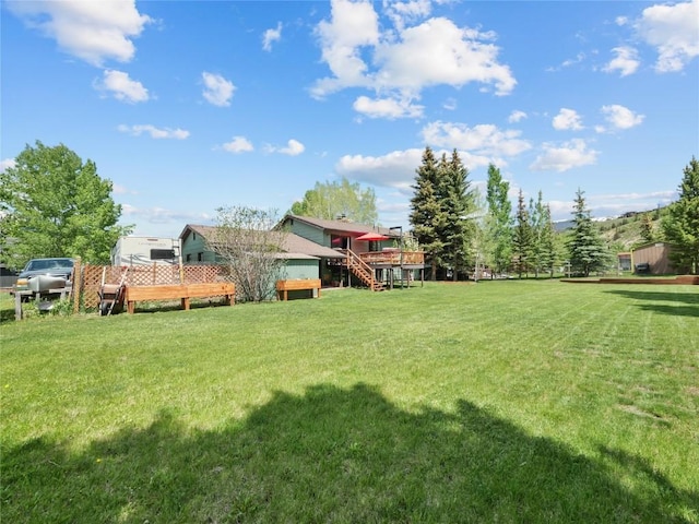 1346 Rainbow Dr, Silverthorne, CO 80498 - view of green lawn with a deck and stairway