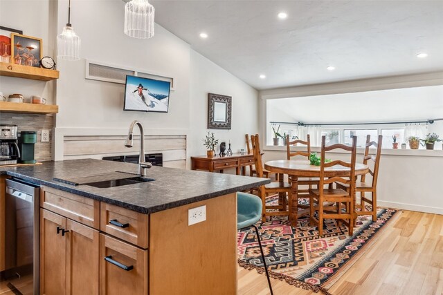 530 Castello Ave, Fairplay, CO 80440 - kitchen featuring dark countertops, recessed lighting, light wood-type flooring, dishwasher, and a kitchen island with sink
