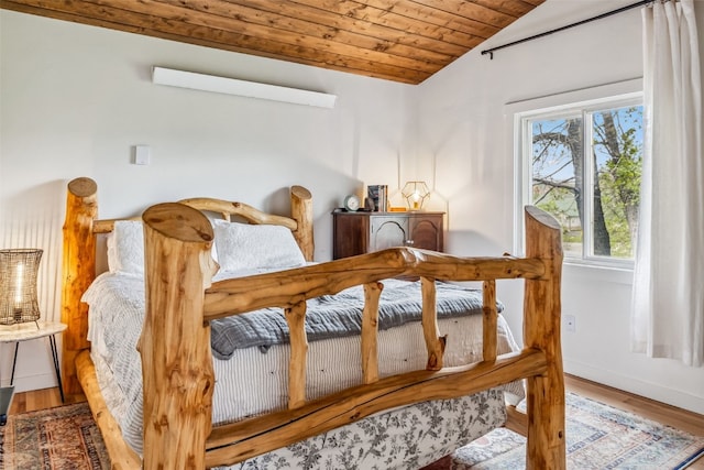 530 Castello Ave, Fairplay, CO 80440 - bedroom featuring lofted ceiling, wood ceiling, wood finished floors, and baseboards