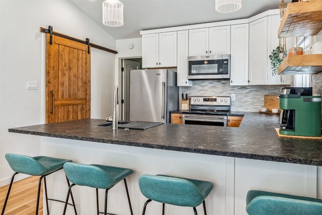 530 Castello Ave, Fairplay, CO 80440 - kitchen with stainless steel appliances, decorative backsplash, and dark countertops