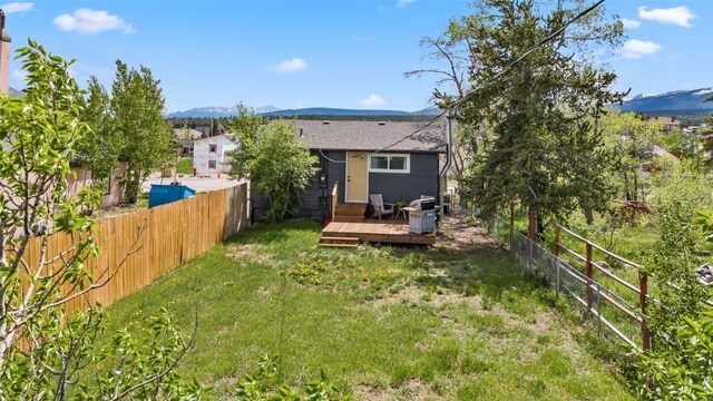530 Castello Ave, Fairplay, CO 80440 - back of house featuring a deck with mountain view and roof with shingles
