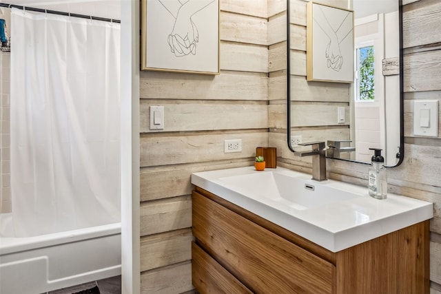 530 Castello Ave, Fairplay, CO 80440 - full bathroom featuring vanity, shower / bath combo with shower curtain, and wood walls