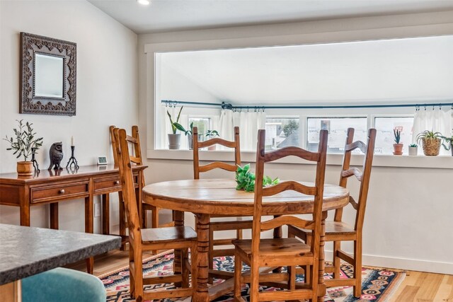 530 Castello Ave, Fairplay, CO 80440 - dining room with wood finished floors, lofted ceiling, recessed lighting, and baseboards