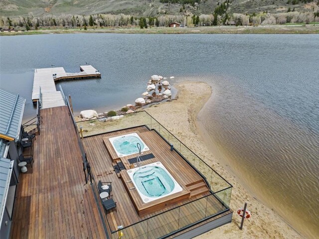 11 Glazer Trl, Silverthorne, CO 80498 - view of dock featuring hot tub deck surround and a water and mountain view