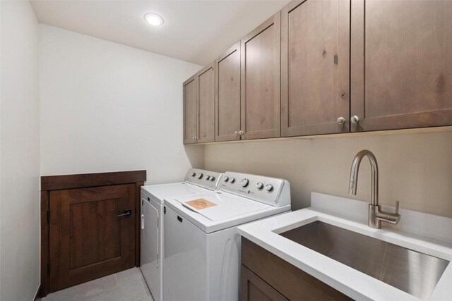 11 Glazer Trl, Silverthorne, CO 80498 - laundry room with recessed lighting, light tile patterned floors, cabinet space, washing machine and clothes dryer, and a sink