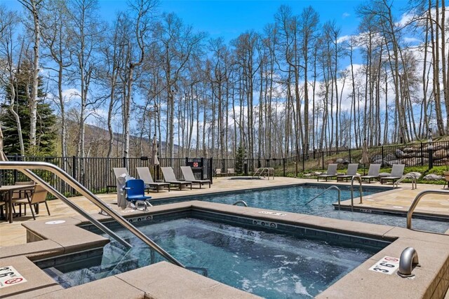11 Glazer Trl, Silverthorne, CO 80498 - pool with fence, a community hot tub, and a patio