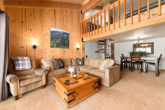 1945 Cornice Rd Unit 304 2334, Steamboat Springs, CO 80487 - living area featuring stairway, wood walls, carpet flooring, and beamed ceiling