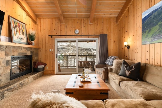1945 Cornice Rd Unit 304 2334, Steamboat Springs, CO 80487 - carpeted living room featuring a fireplace, wood walls, wood ceiling, and vaulted ceiling with beams